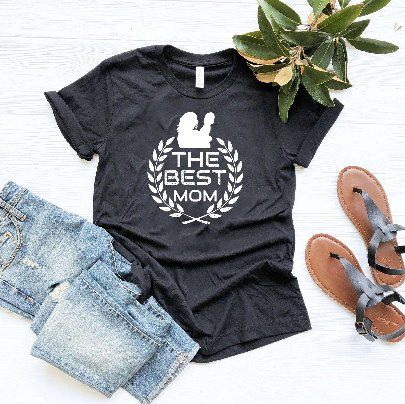 A stylish unisex T-shirt in various colors, featuring the text 'The Best Mom Shirt' printed on it, showcasing its comfortable design and quality fabric.