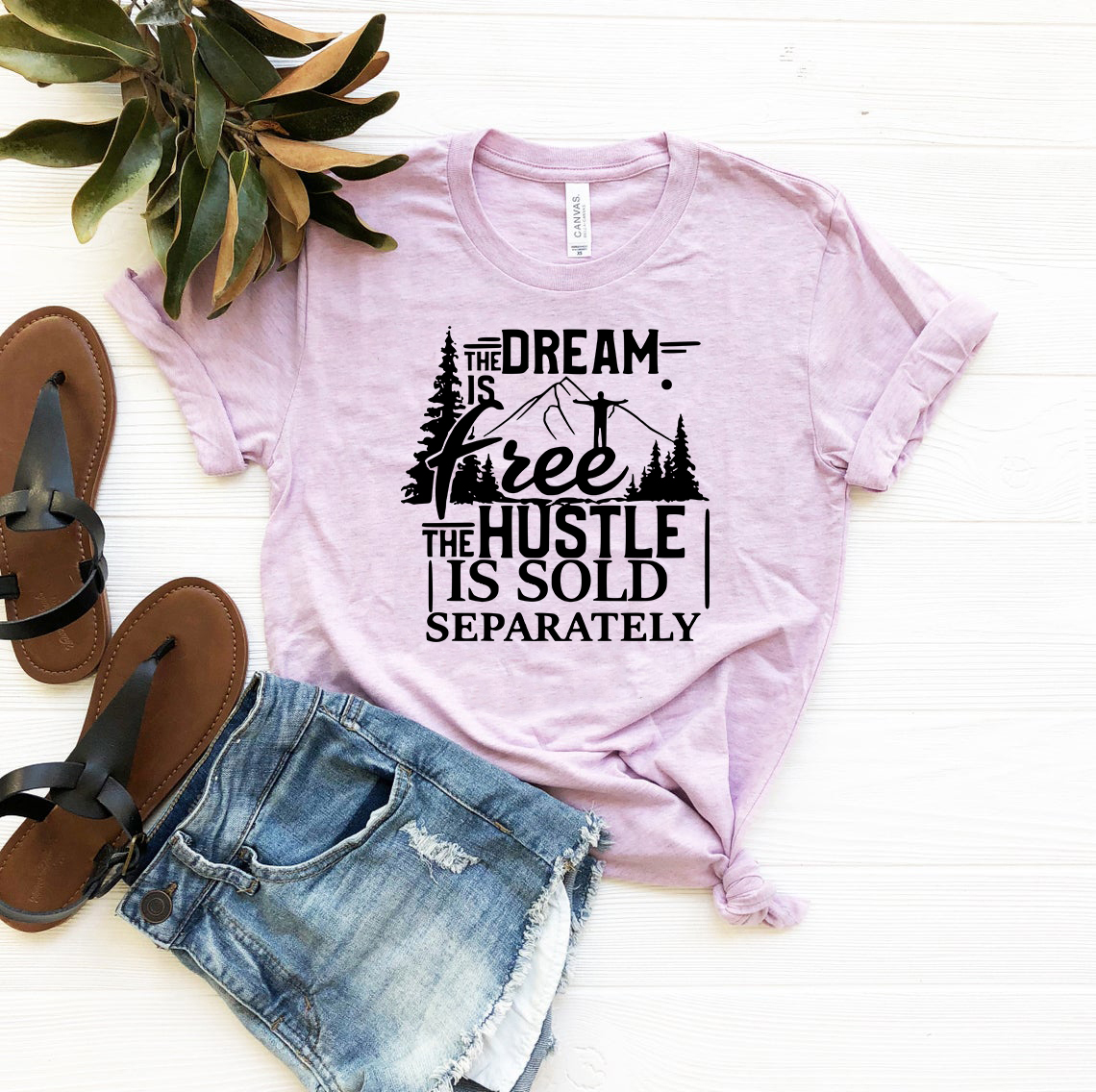 Unisex T-shirt featuring 'The Dream Is Free The Hustle Is Sold Separately' motivational print in various colors.