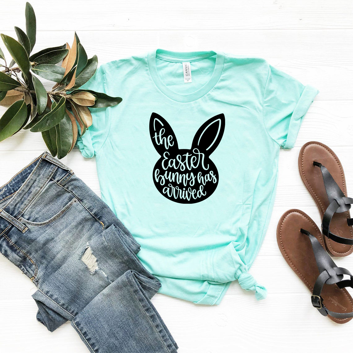 A colorful unisex T-shirt featuring a cheerful Easter Bunny design, made from soft ring spun cotton, available in multiple sizes and colors.