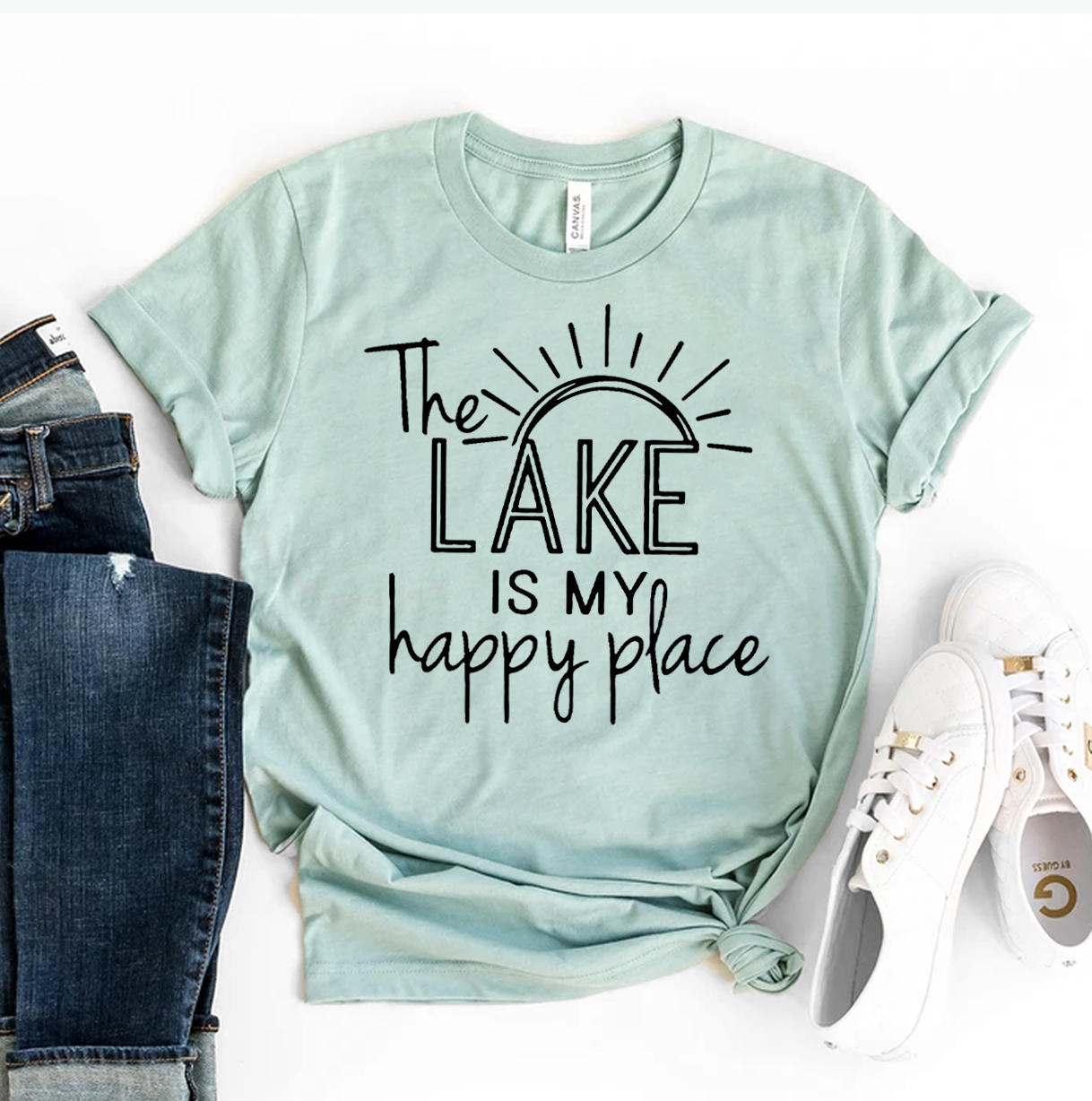 The Lake Is My Happy Place T-shirt featuring a serene lake design, made from soft ring spun cotton, available in various sizes.