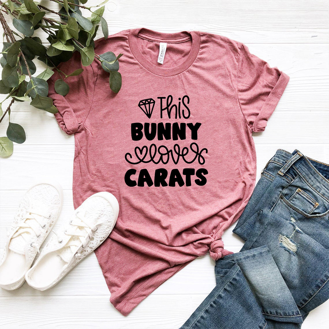 Unisex T-shirt featuring a playful bunny design with the text 'This Bunny Loves Carats', made from soft ring spun cotton.