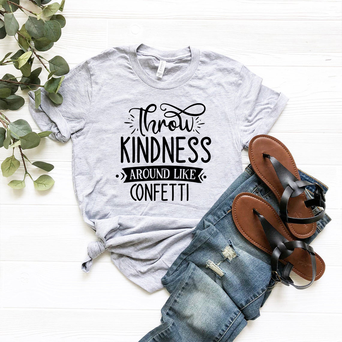 Unisex Throw Kindness Around Like Confetti Shirt in various colors, showcasing its soft fabric and stylish design.