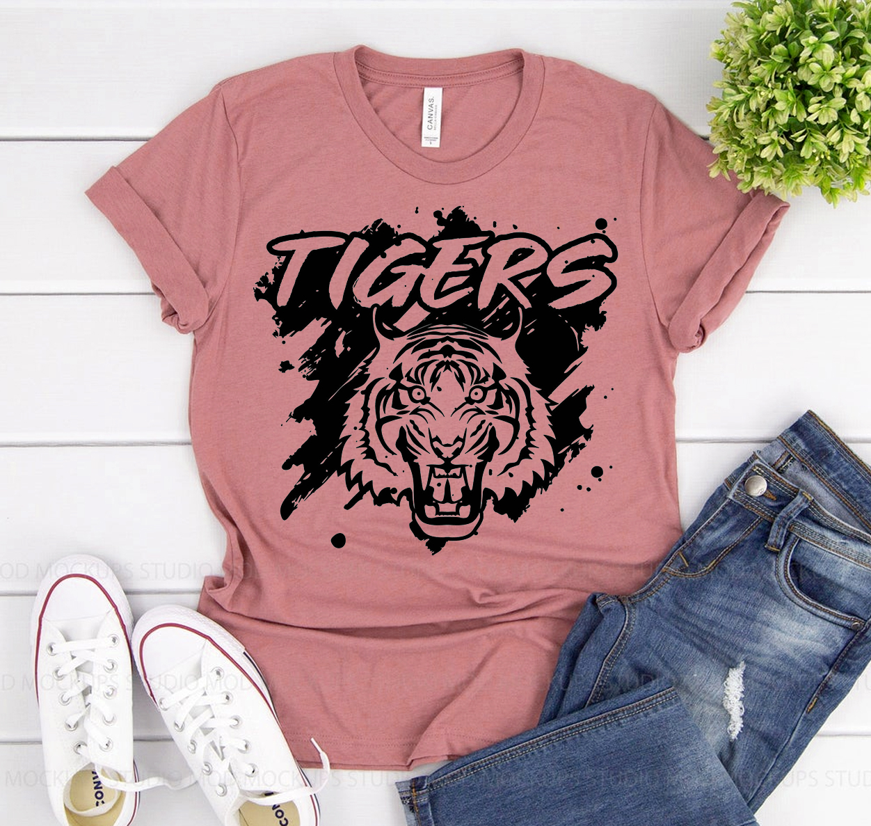 Tigers Football T-shirt displayed on a hanger, showcasing its classic unisex design and vibrant colors.