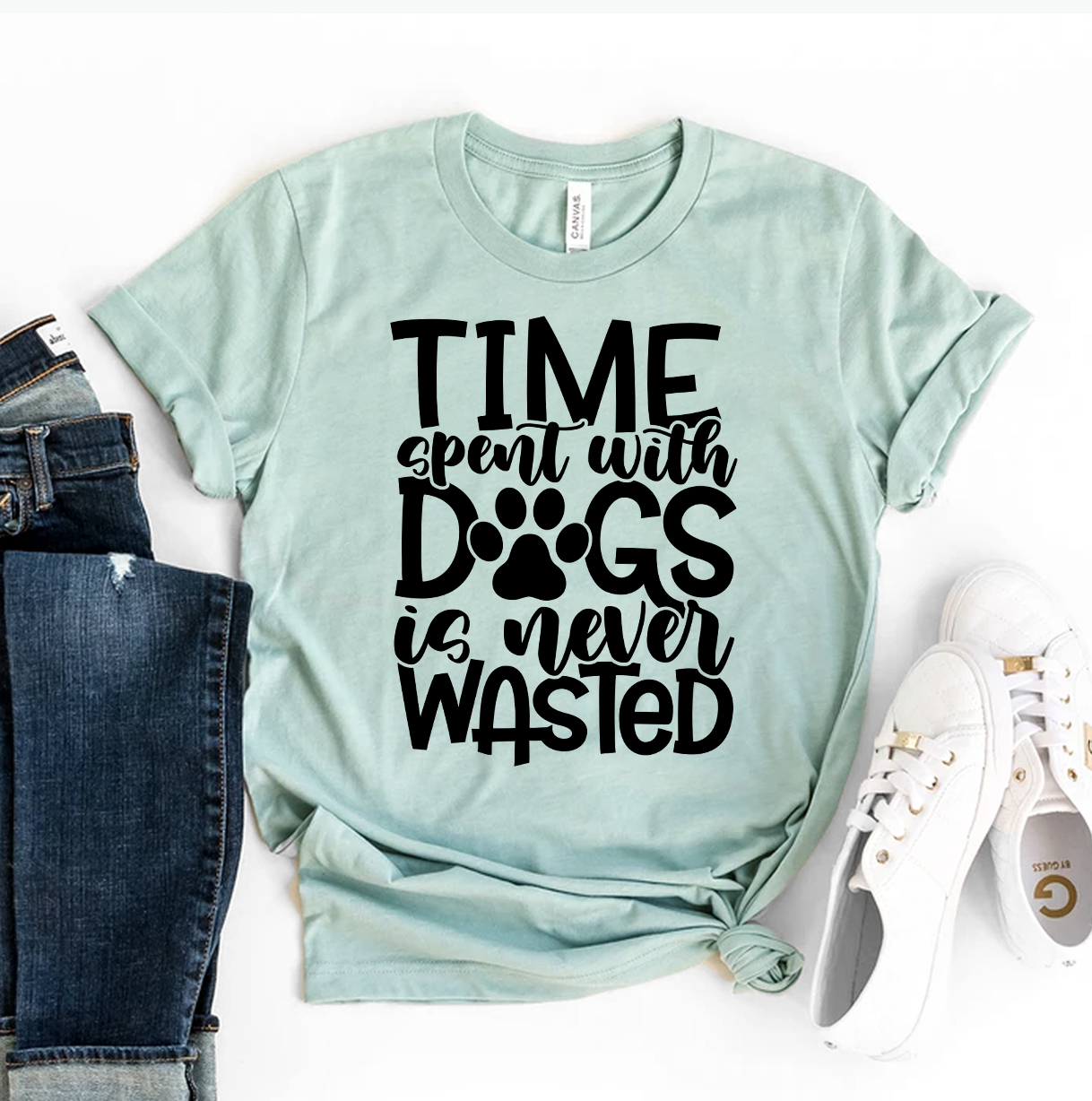 A stylish T-shirt featuring the phrase 'Time Spent With Dogs Is Never Wasted', made from premium ring spun cotton.