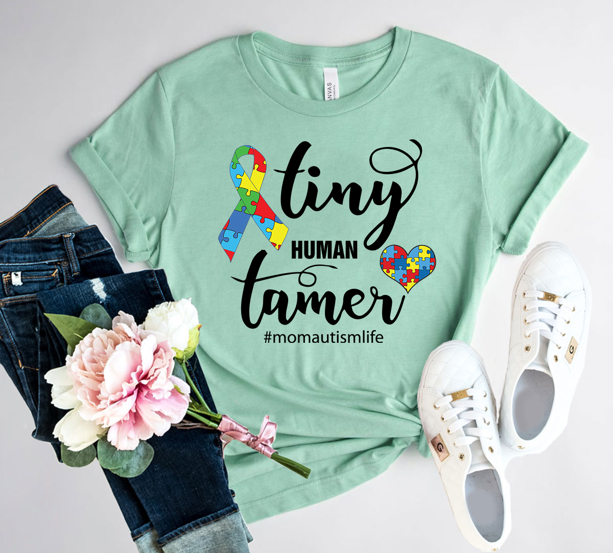 A comfortable unisex Tiny Human Tamer Shirt made from soft ring spun cotton, available in multiple colors and sizes.