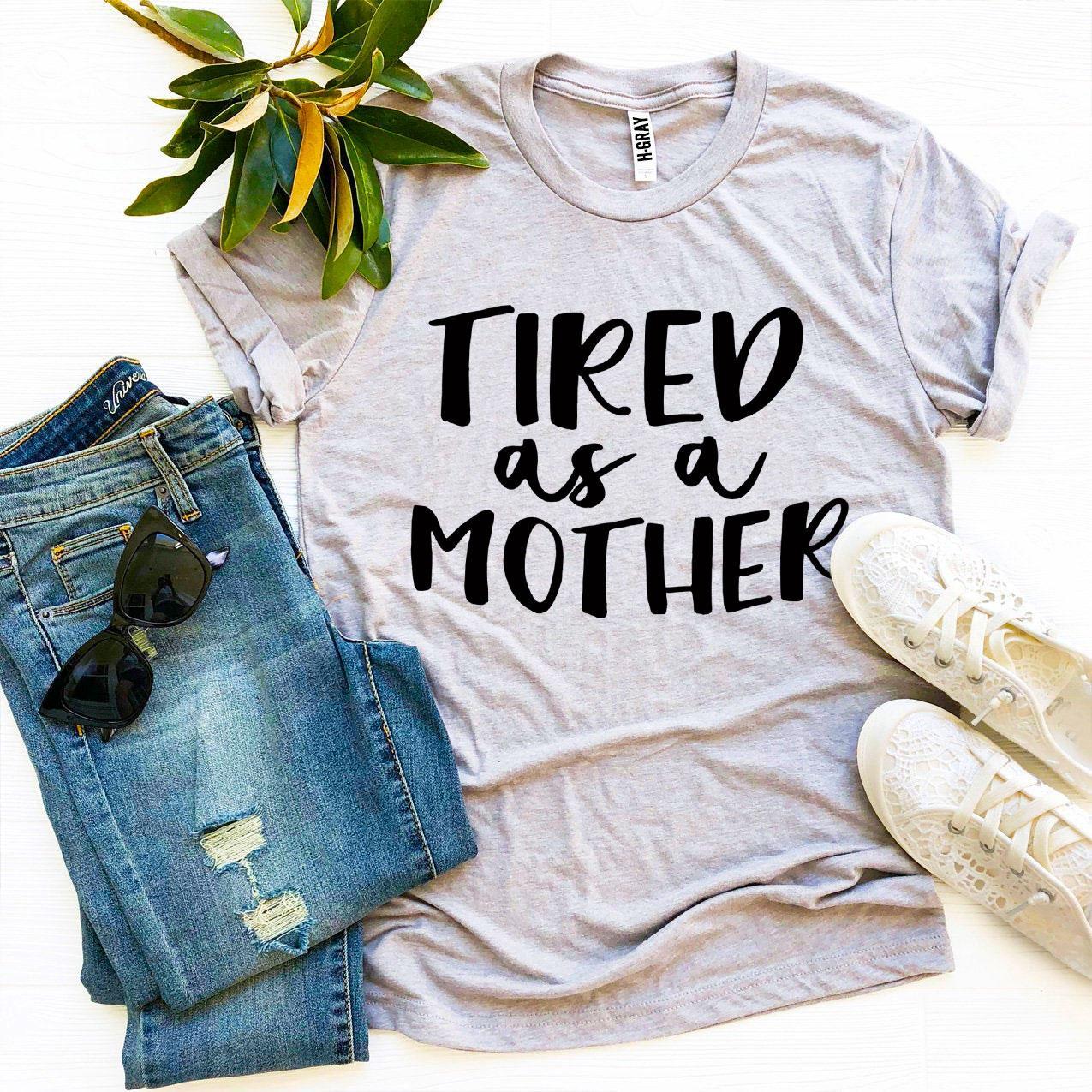 Tired As a Mother T-shirt in premium ring spun cotton, featuring a stylish print and available in various sizes.