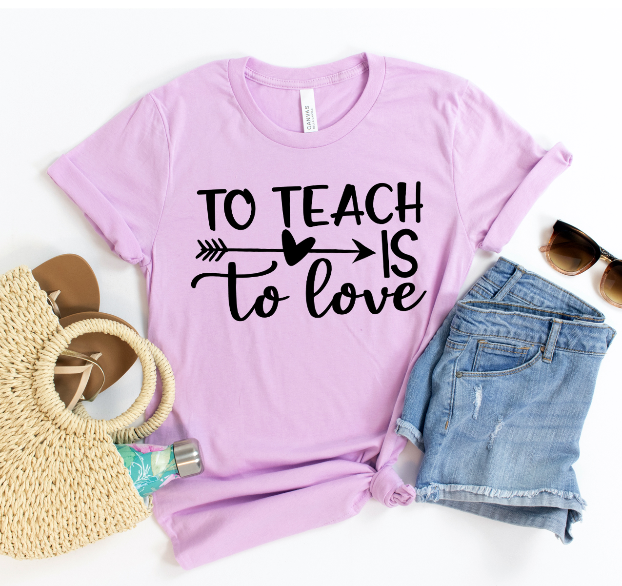 A stylish unisex T-shirt featuring the phrase 'To Teach Is To Love', made from soft airlume cotton, perfect for educators.