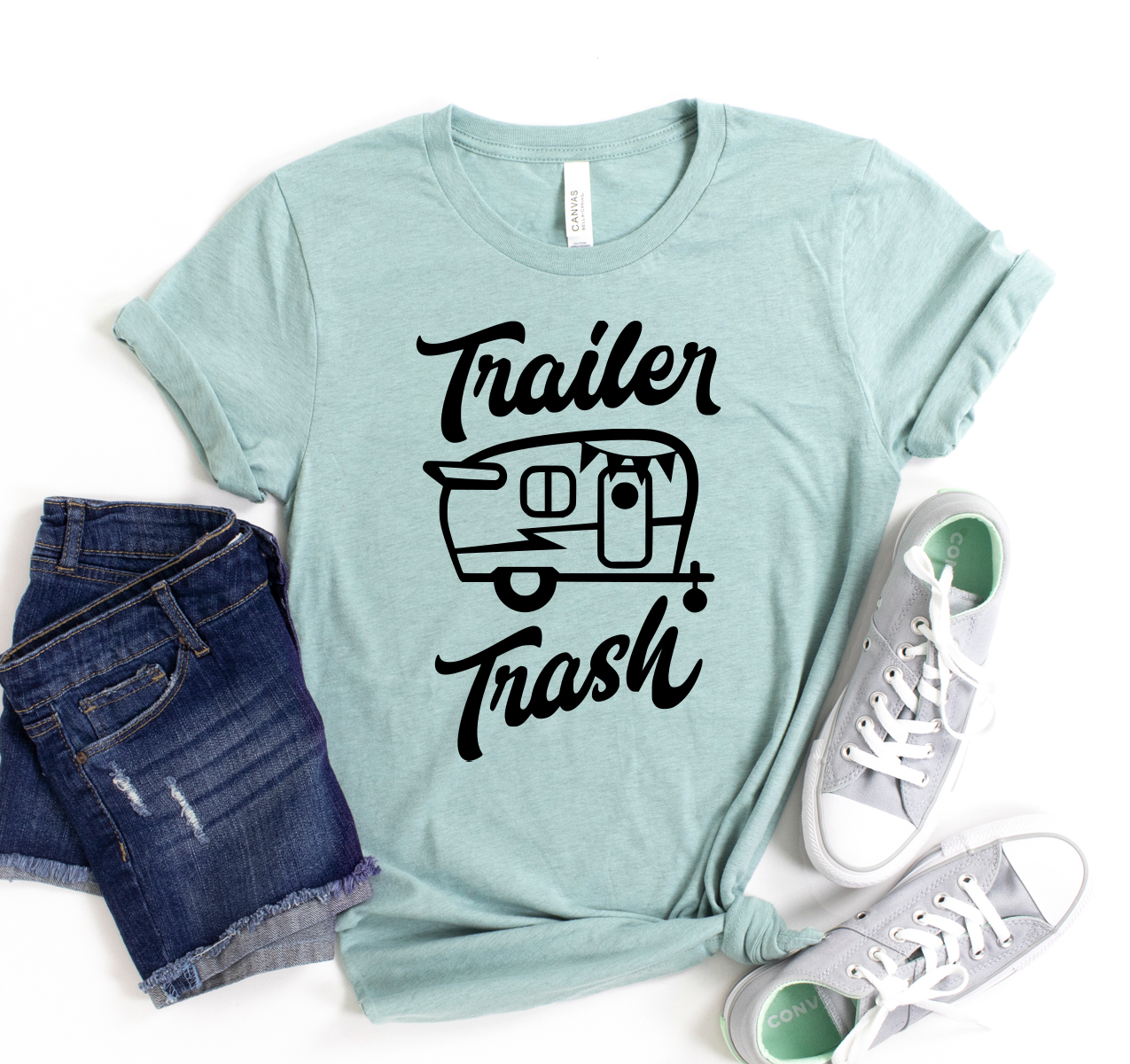 A classic unisex Trailer Trash T-shirt made from soft airlume cotton, showcasing its retail-inspired design and available sizes.