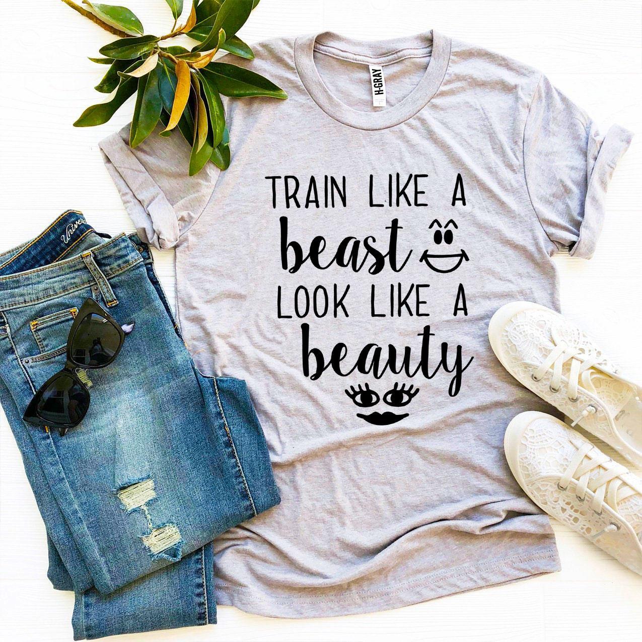 Train Like a Beast Look Like a Beauty T-shirt in various sizes, showcasing its premium quality and stylish design.