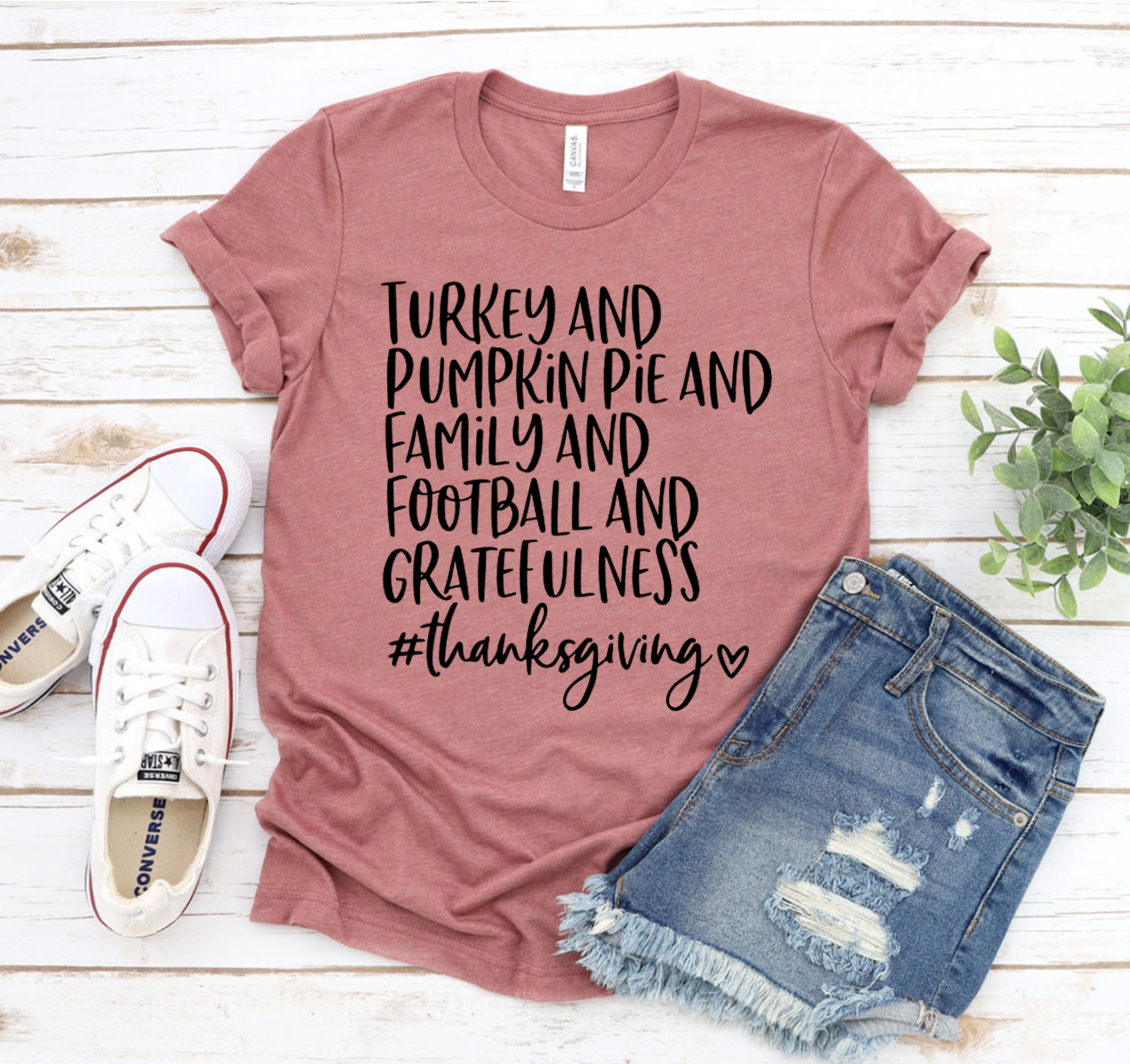 A festive Turkey & Pumpkin Pie T-shirt featuring a vibrant design, made from soft cotton fabric, perfect for Thanksgiving celebrations.