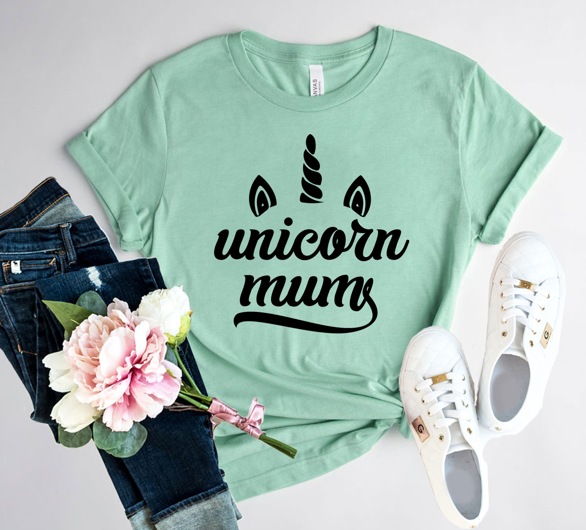 A stylish Unicorn Mums Shirt made from soft ring spun cotton, featuring a crew neck and short sleeves, available in multiple colors.