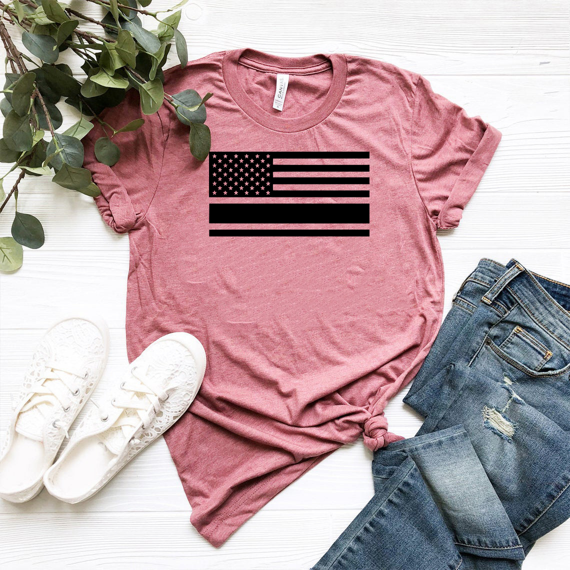 A comfortable unisex USA Flag Shirt made from ring spun cotton, featuring a vibrant print of the American flag.