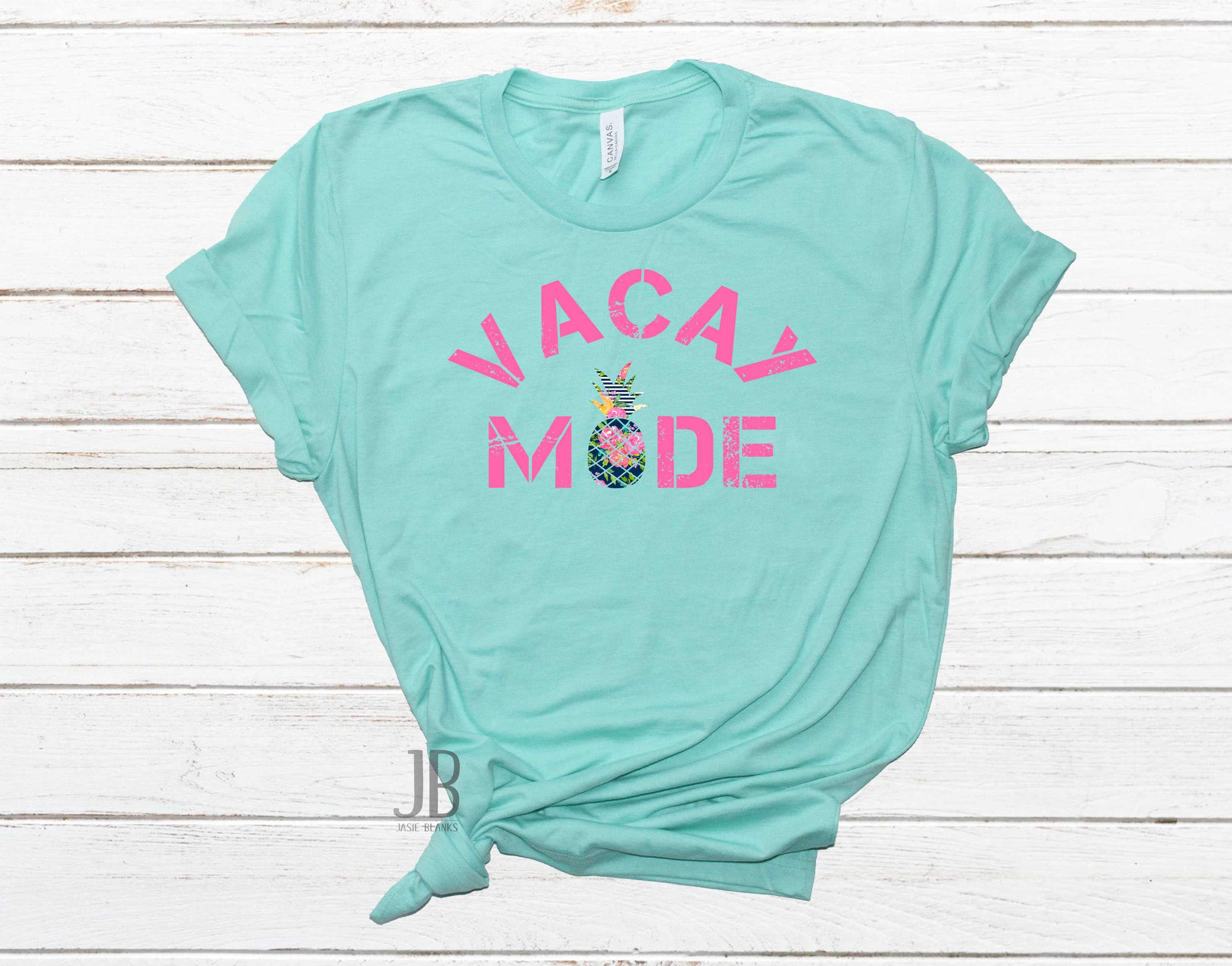 A stylish unisex graphic tee featuring the text 'VACAY MODE' in vibrant colors, perfect for casual wear.