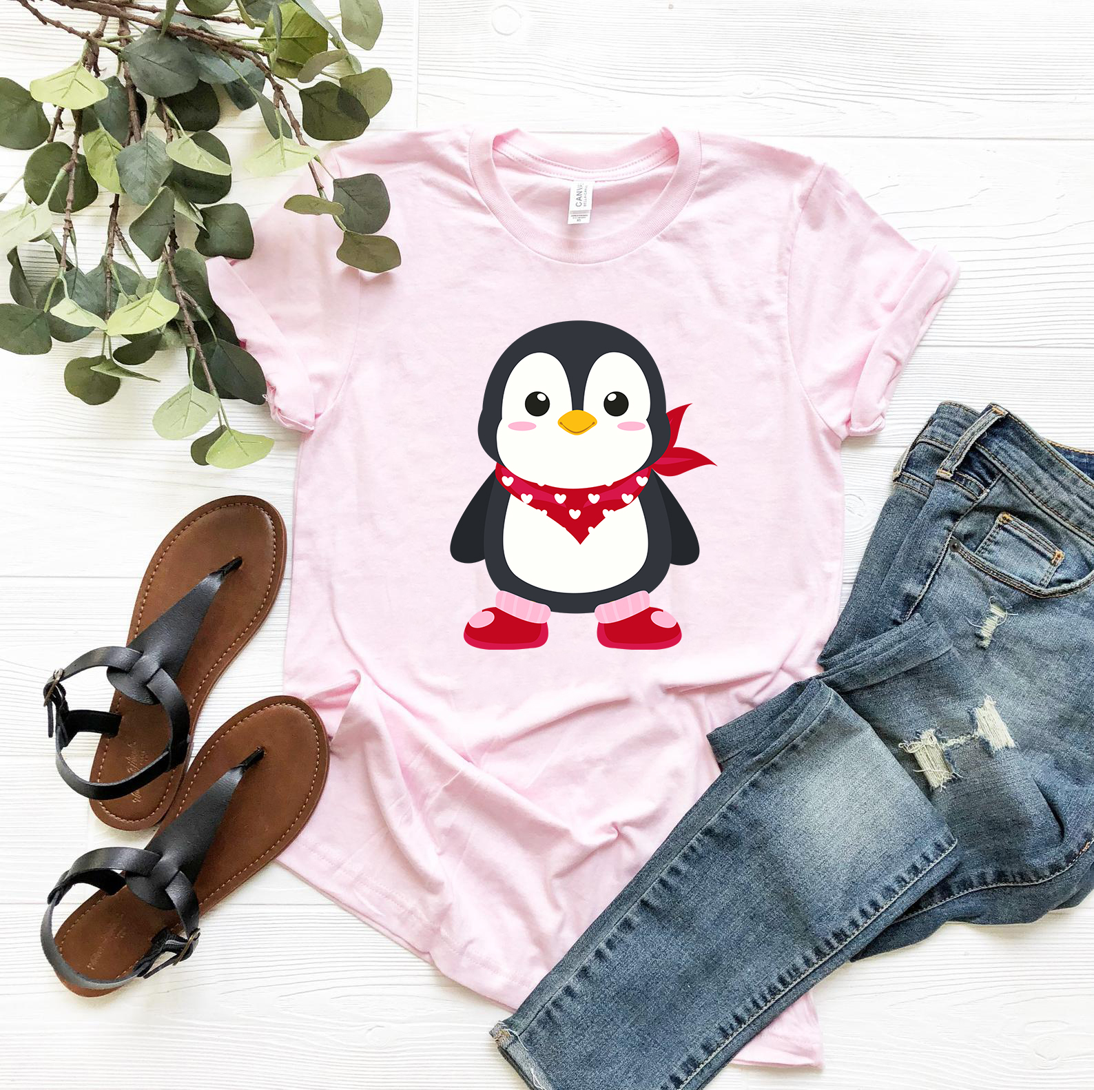 A unisex Valentines Penguin Shirt featuring a cute penguin design, made from soft ring spun cotton, available in various colors.