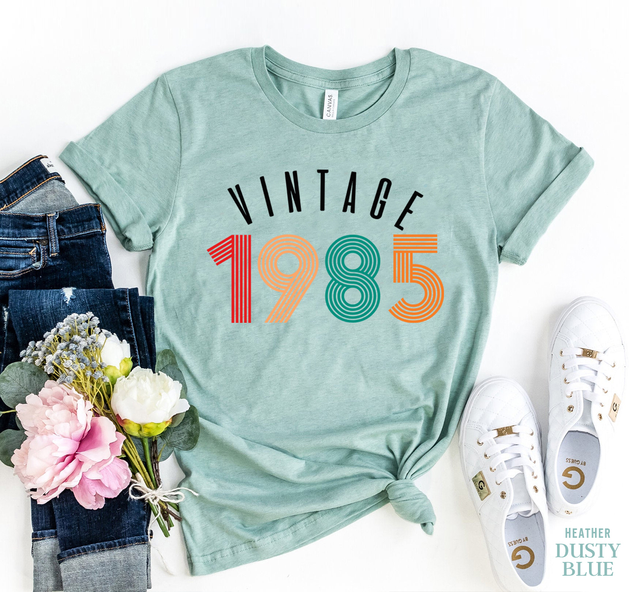 Vintage 1985 T-shirt made of premium ring spun cotton with a striking flex print design, available in various sizes.