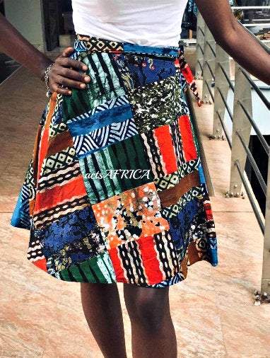 A vibrant Vintage Batik Wrap Mini Kitenge Skirt featuring unique handmade patterns and adjustable straps, perfect for various occasions.