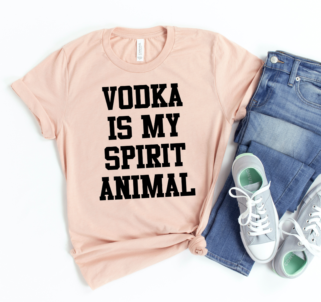 A stylish unisex t-shirt featuring the phrase 'Vodka Is My Spirit Animal' in bold print, made from soft cotton fabric.