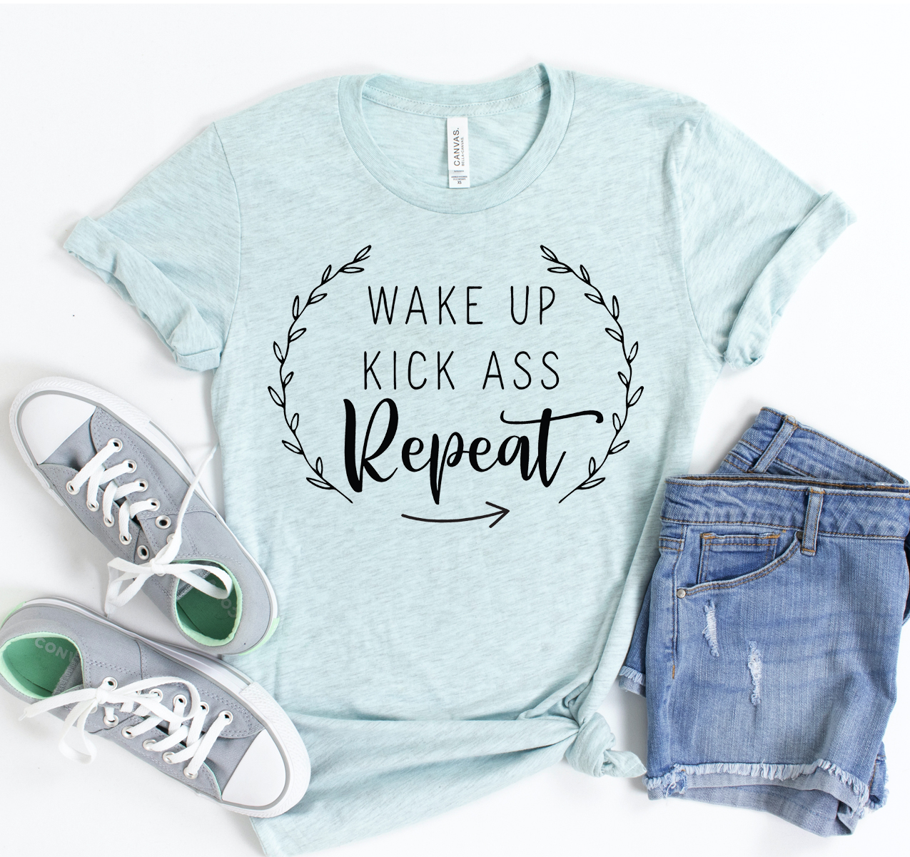 Wake Up Kick Ass Repeat T-shirt in unisex design, made from soft airlume cotton, featuring a motivational print.