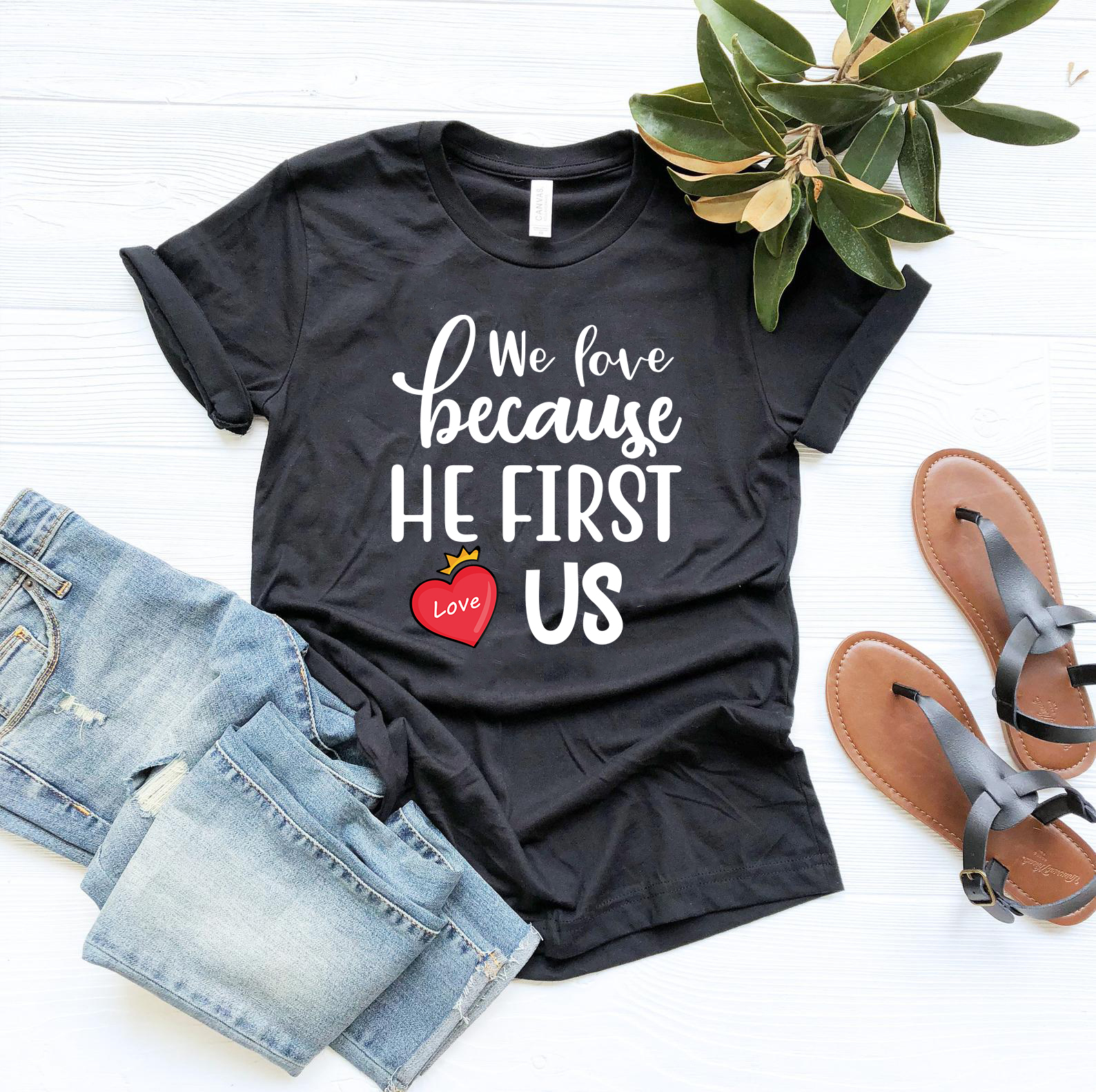 We Love Because He First Loved Us Shirt in various colors, showcasing its comfortable fit and stylish design.