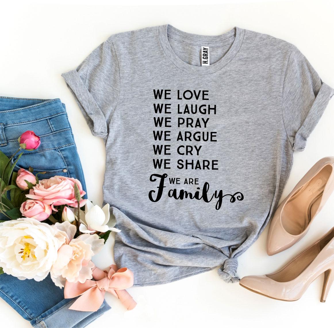 We Love We Laugh We Are Family T-shirt in various sizes, showcasing its soft cotton fabric and vibrant print design.