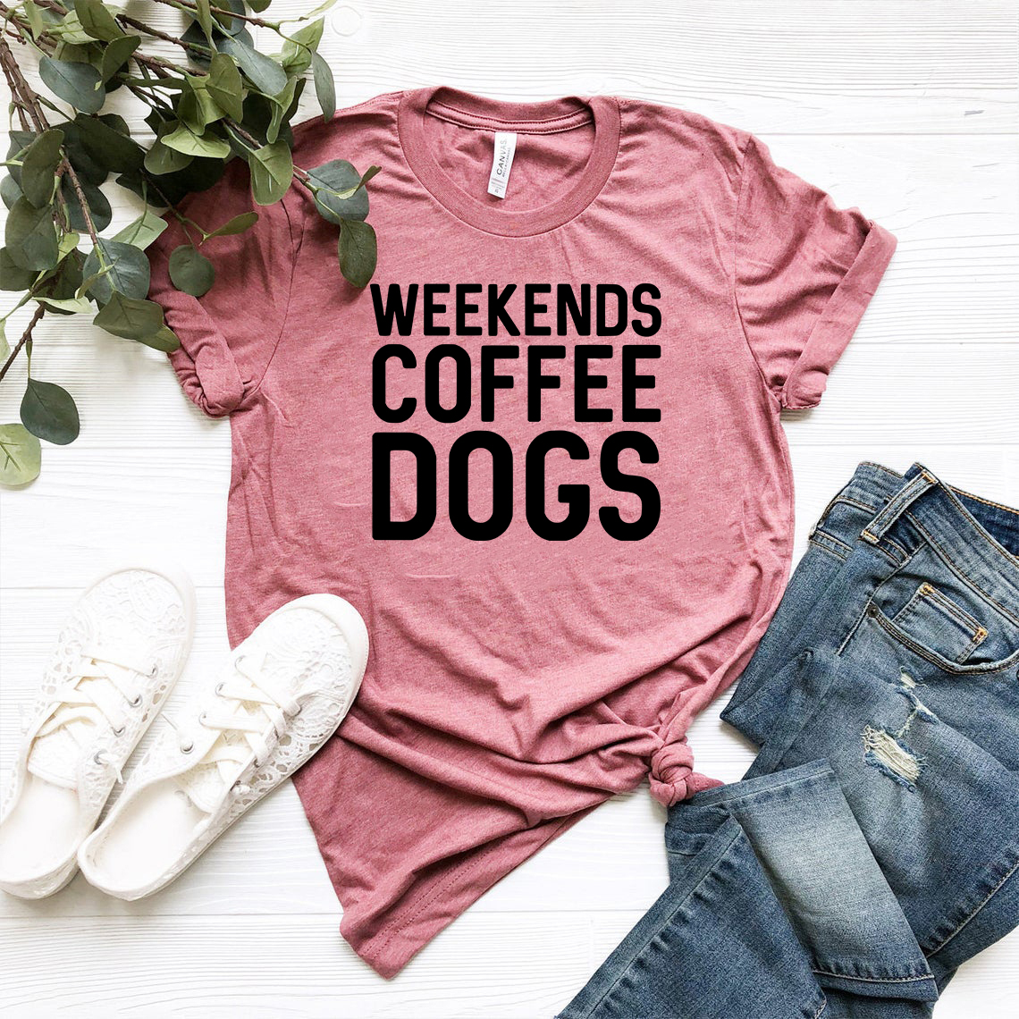 A comfortable unisex T-shirt featuring a fun coffee and dogs design, available in multiple colors.