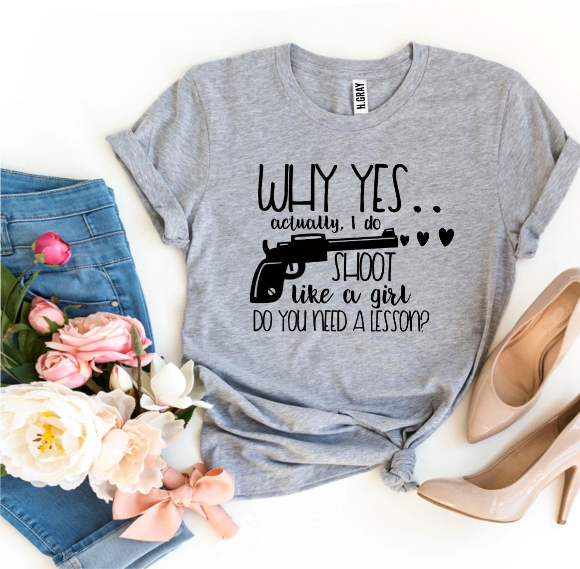 A stylish black t-shirt featuring the phrase 'Why Yes Actually I Do Shoot Like a Girl' in bold print, made from premium quality cotton.