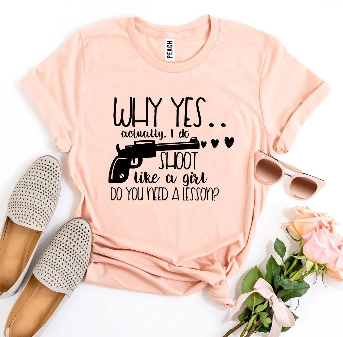 A stylish black t-shirt featuring the phrase 'Why Yes Actually I Do Shoot Like a Girl' in bold print, made from premium quality cotton.