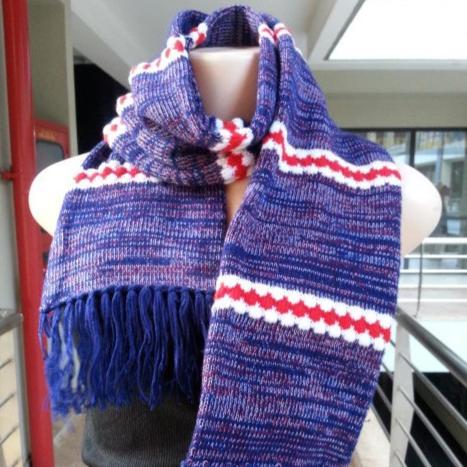 A cozy woolen hand-knitted scarf in a classic ribbed stitch, measuring 50 inches long, perfect for unisex winter wear.