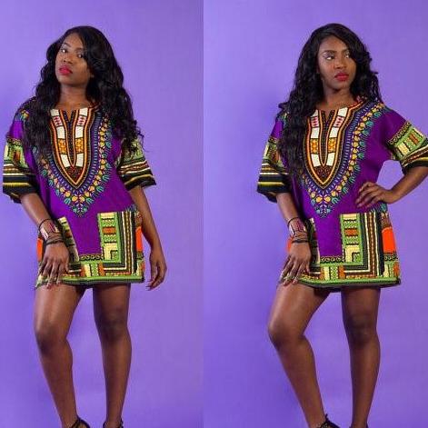 Women Dashiki African Shirt in vibrant purple, made from 100% cotton, showcasing its unique symmetrical design.