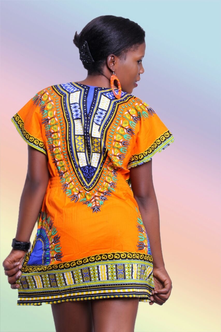 Vibrant orange Women Kaftan Dashiki Mini Dress with matching wooden earrings, showcasing a stylish and comfortable design.