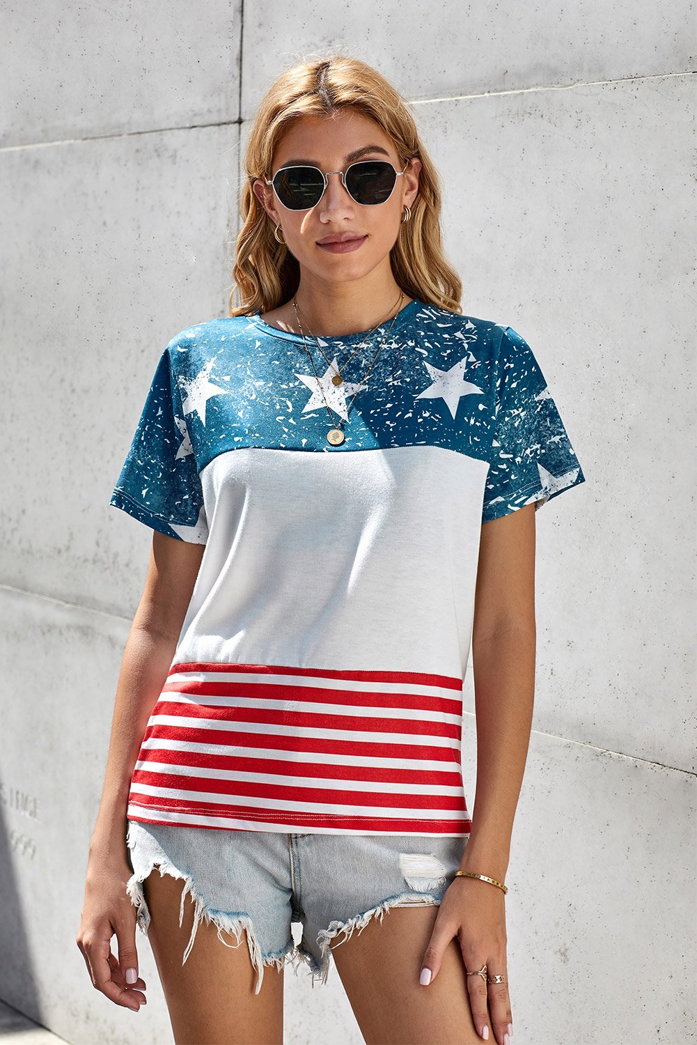 Women’s short sleeve tee featuring an American flag print, perfect for summer casual wear.