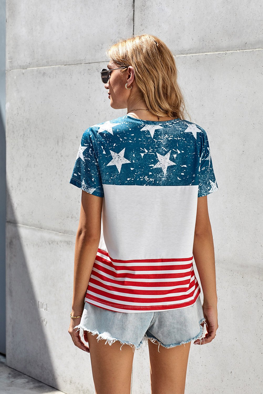 Women’s short sleeve tee featuring an American flag print, perfect for summer casual wear.