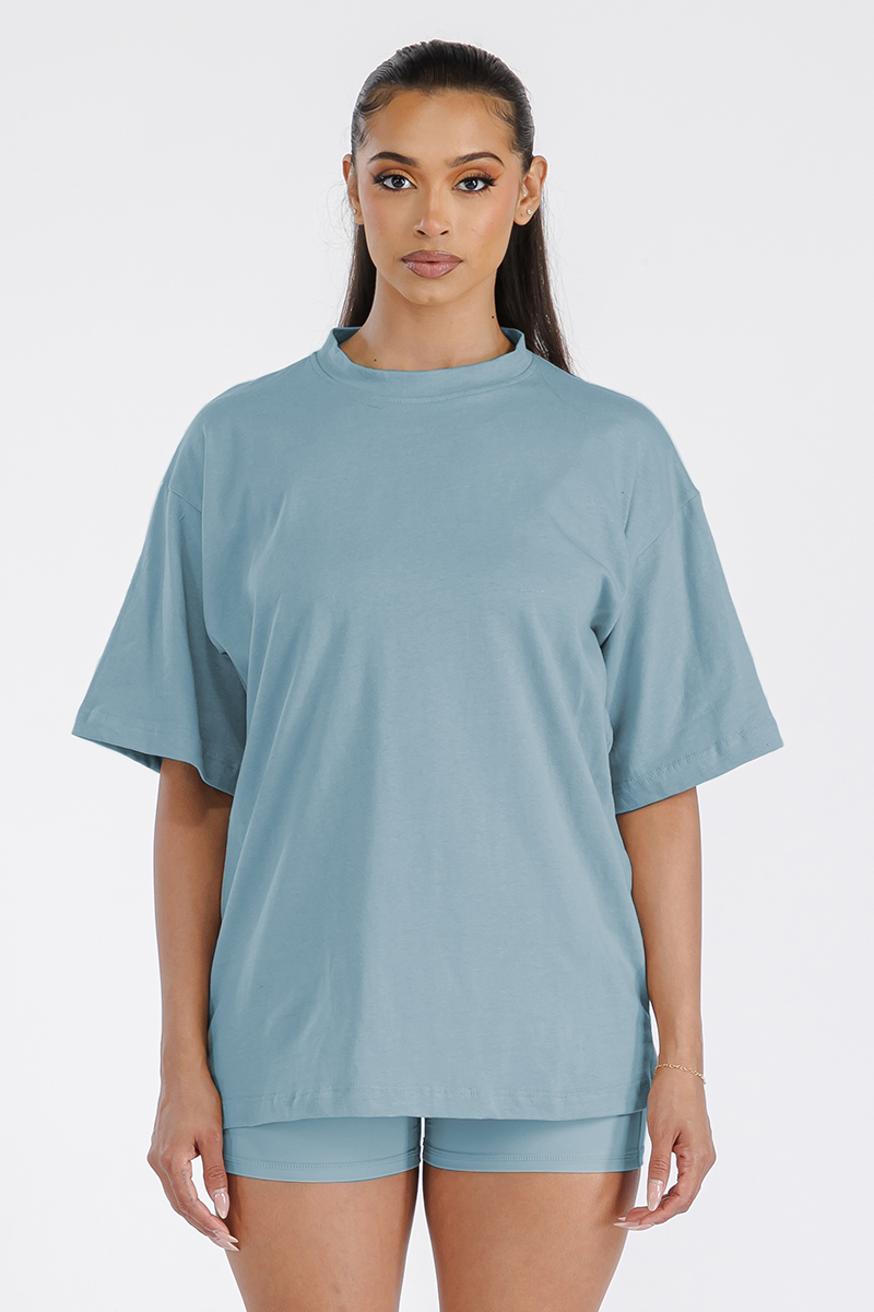 A stylish Women's Boyfriend Oversized Drop Shoulder Tee in soft cotton, featuring a round neck and drop shoulder design, perfect for workouts or lounging.