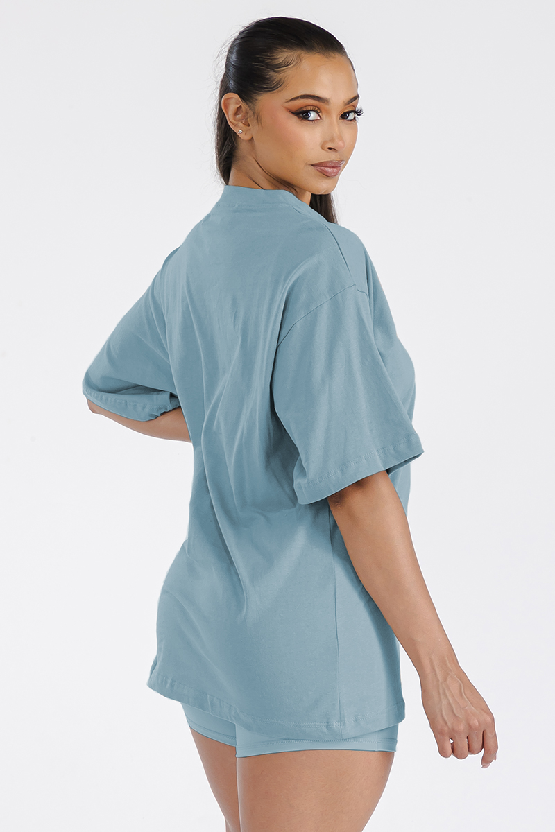 A stylish Women's Boyfriend Oversized Drop Shoulder Tee in soft cotton, featuring a round neck and drop shoulder design, perfect for workouts or lounging.