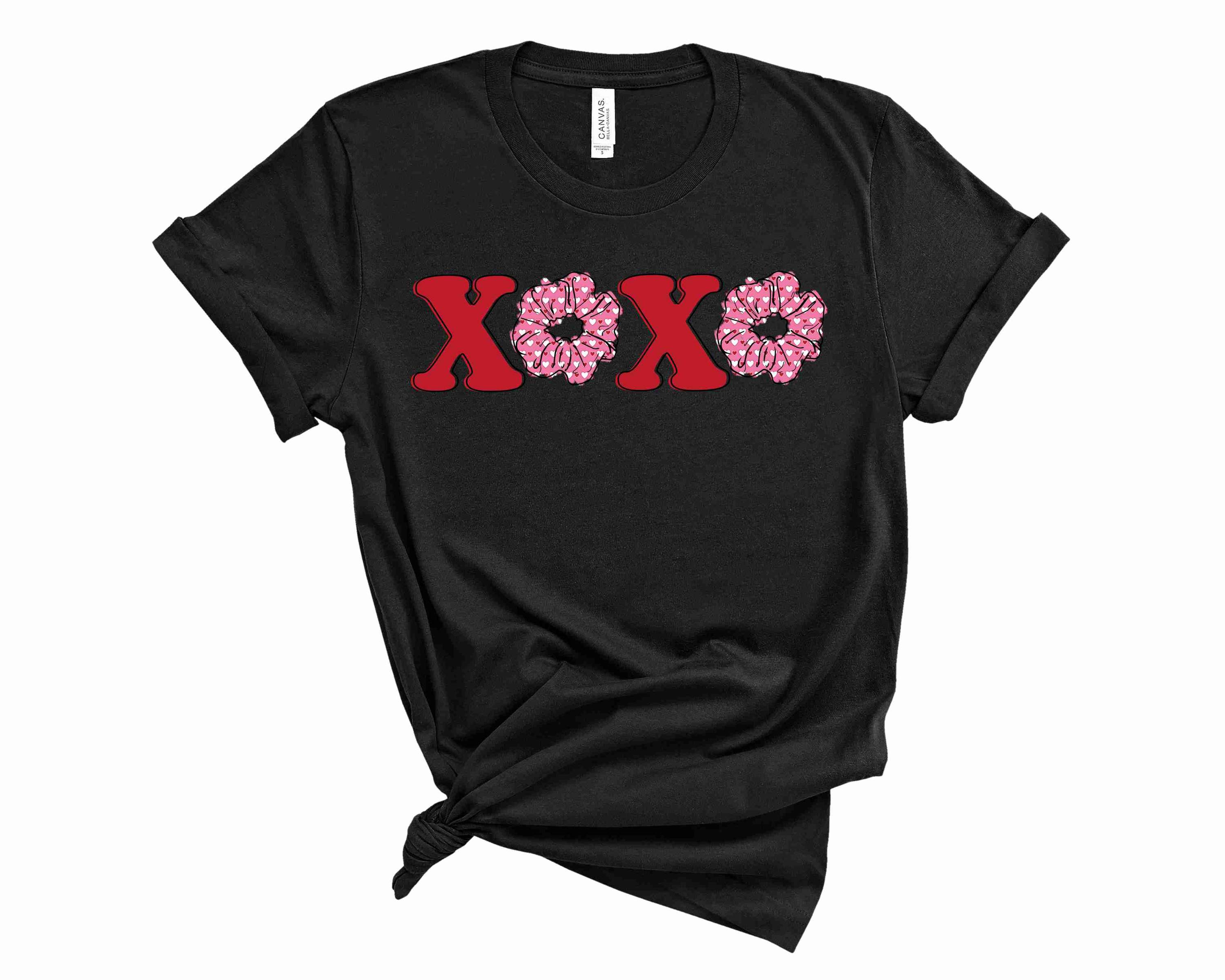 XOXO Scrunchie Graphic Tee displayed on a mannequin, showcasing its trendy design and comfortable fit.