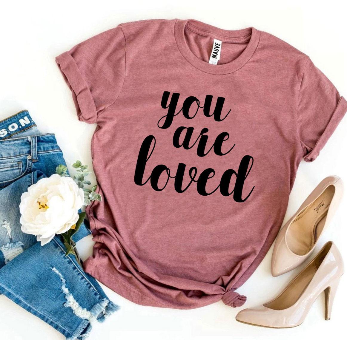 You Are Loved T-shirt made of premium ring spun cotton with a soft feel and vibrant print, available in various sizes.