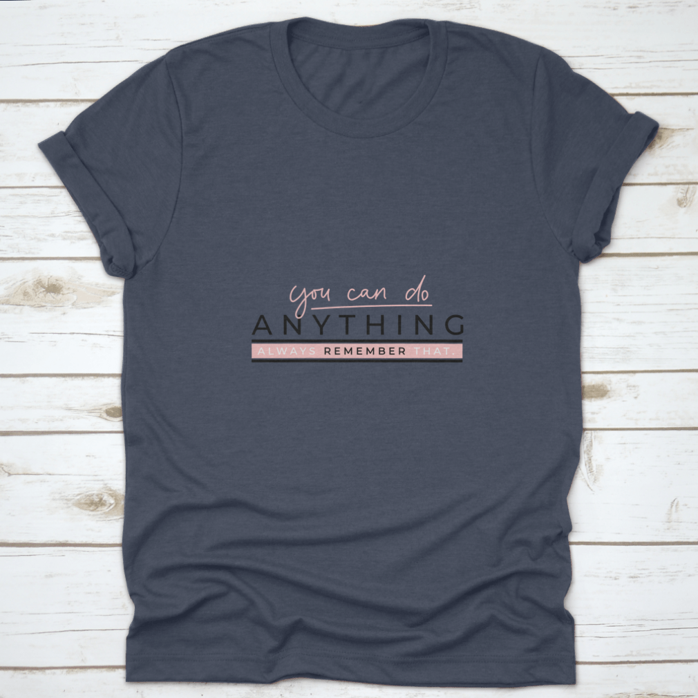 A motivational T-shirt featuring the quote 'You Can Do Anything' in stylish blush pink lettering on a soft cotton fabric.