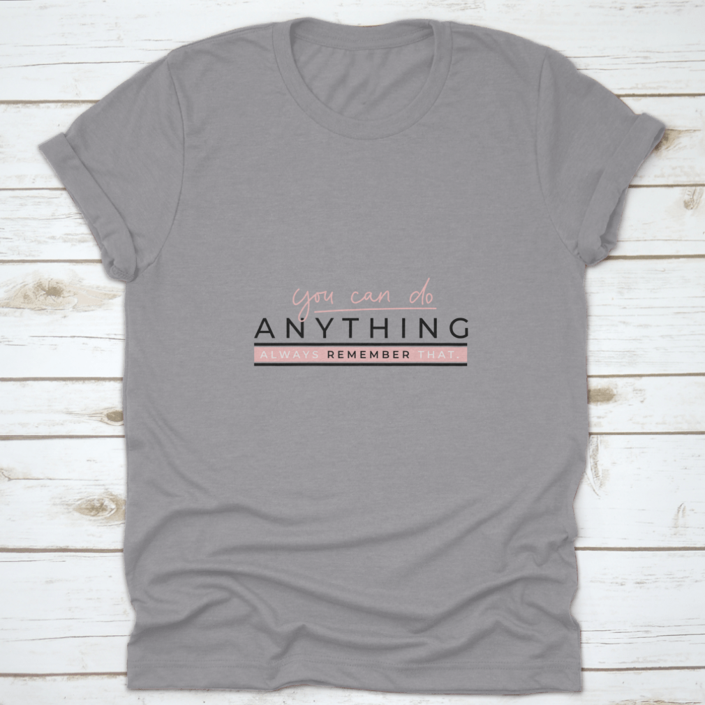 A motivational T-shirt featuring the quote 'You Can Do Anything' in stylish blush pink lettering on a soft cotton fabric.