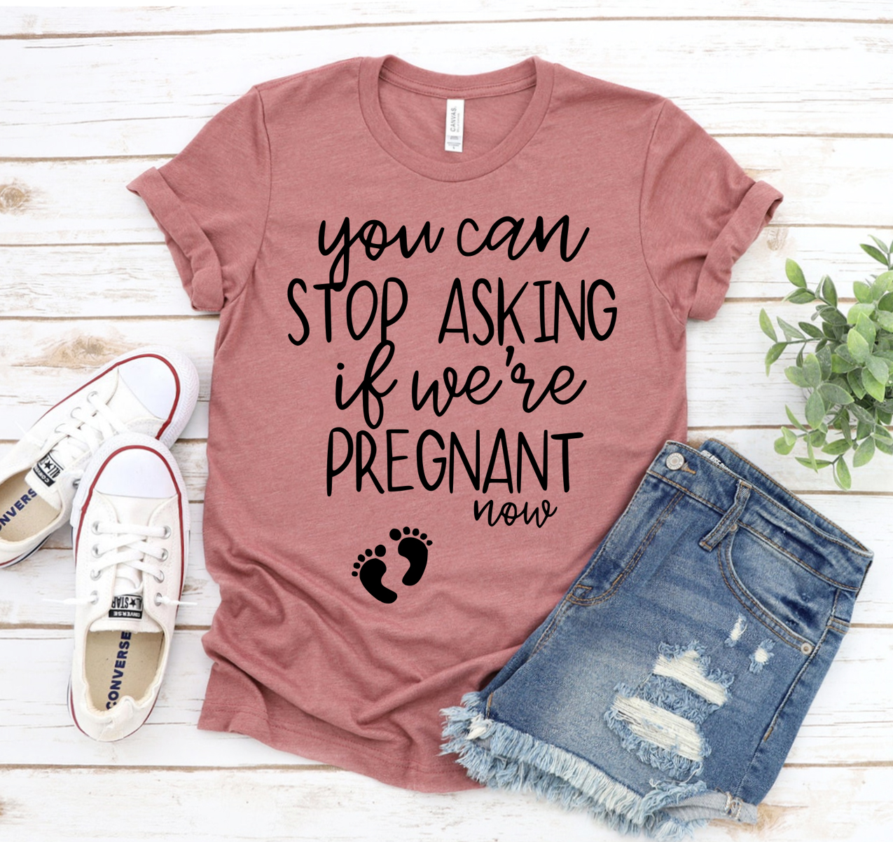 A humorous unisex t-shirt featuring the phrase 'You Can Stop Asking If We Are Pregnant' in a stylish font, made from soft cotton.