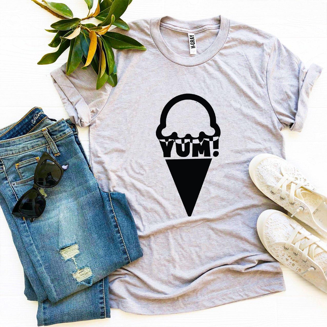 Yum T-shirt made of premium ring spun cotton, featuring a soft textile flex print design, available in various sizes.