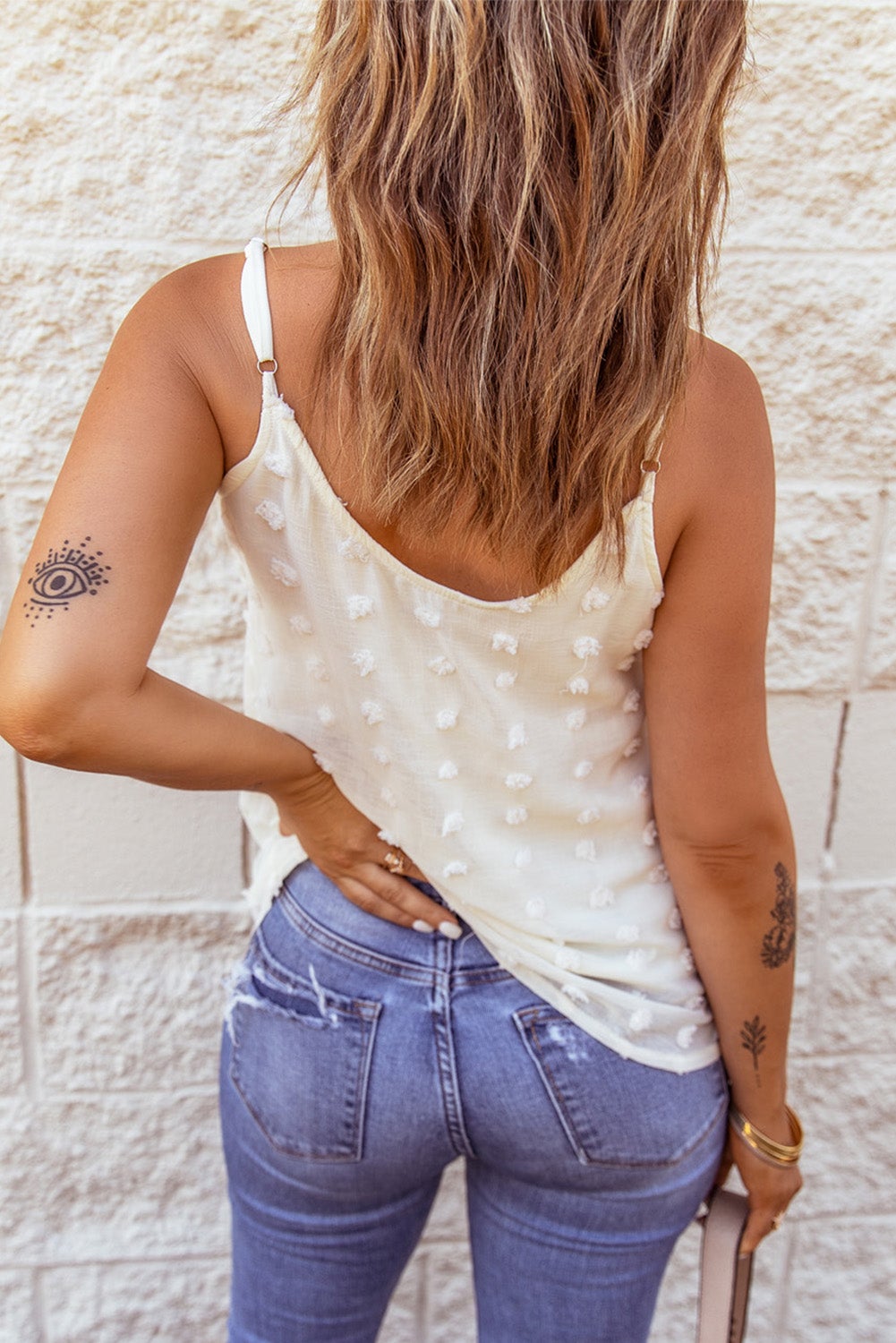 Beige Swiss Dot Tank top featuring adjustable spaghetti straps and button closure, perfect for summer wear.