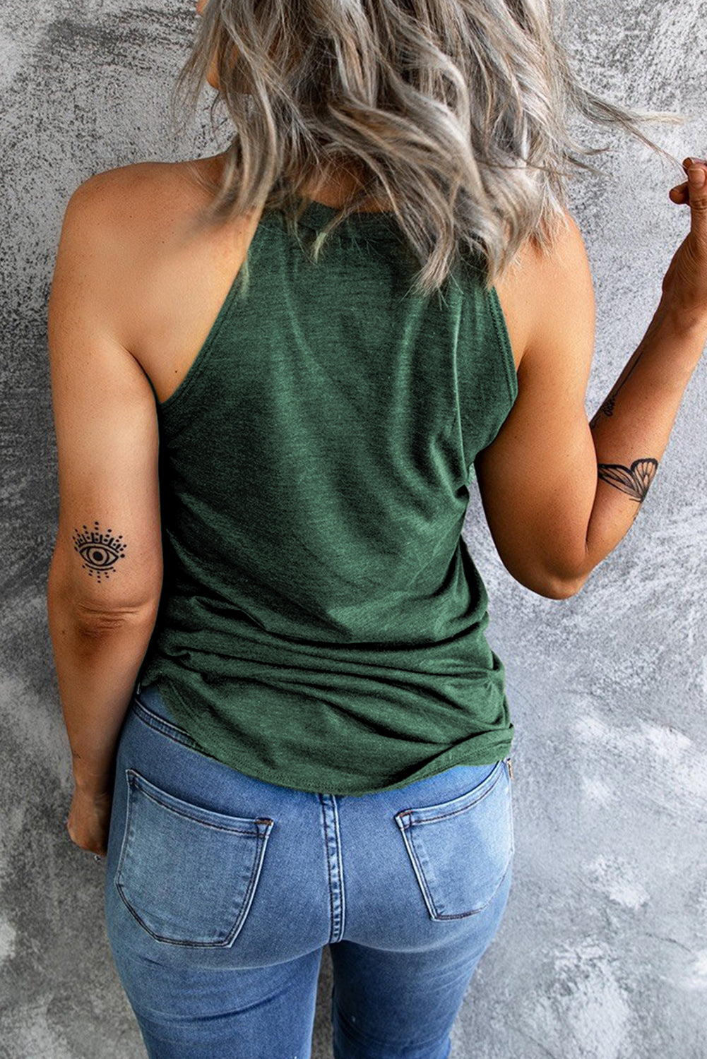 A stylish Brief Green Crew Neck Tank Top displayed on a mannequin, showcasing its sleeveless design and soft fabric.