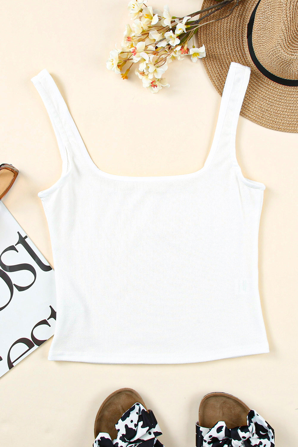 A stylish white ribbed crop tank top featuring a square neckline and a skinny fit, perfect for summer wear.