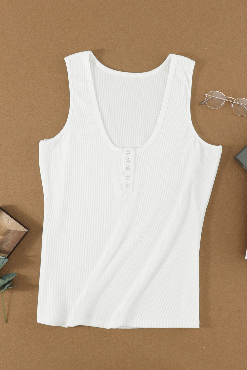 Women's white sleeveless scoop neck tank top with button placket detail, perfect for summer wear.