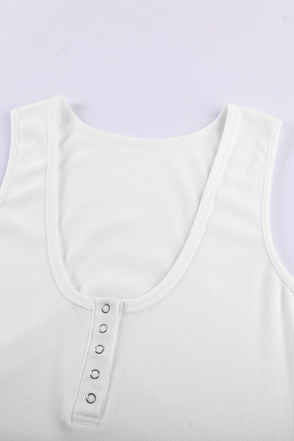 Women's white sleeveless scoop neck tank top with button placket detail, perfect for summer wear.