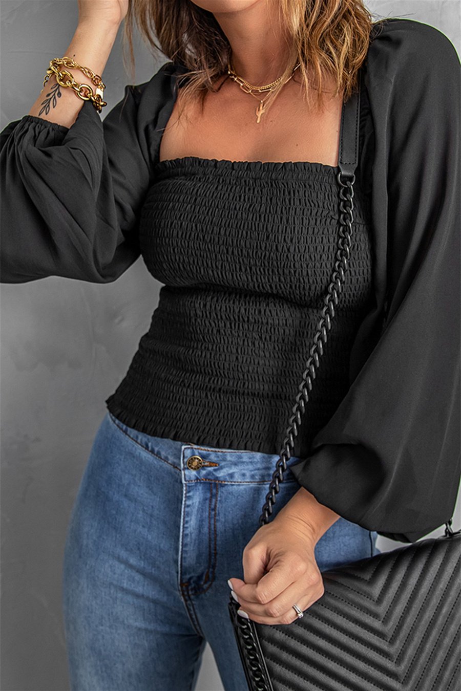 Black Puff Sleeve Smocked Top featuring a square neckline and elegant puff sleeves, perfect for casual wear.