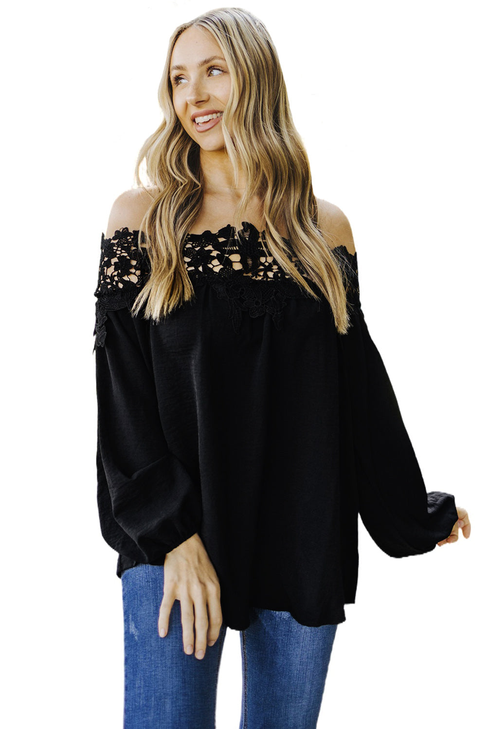 A stylish woman wearing a Blooming Lace Off The Shoulder Top, showcasing its elegant design and lace detailing.