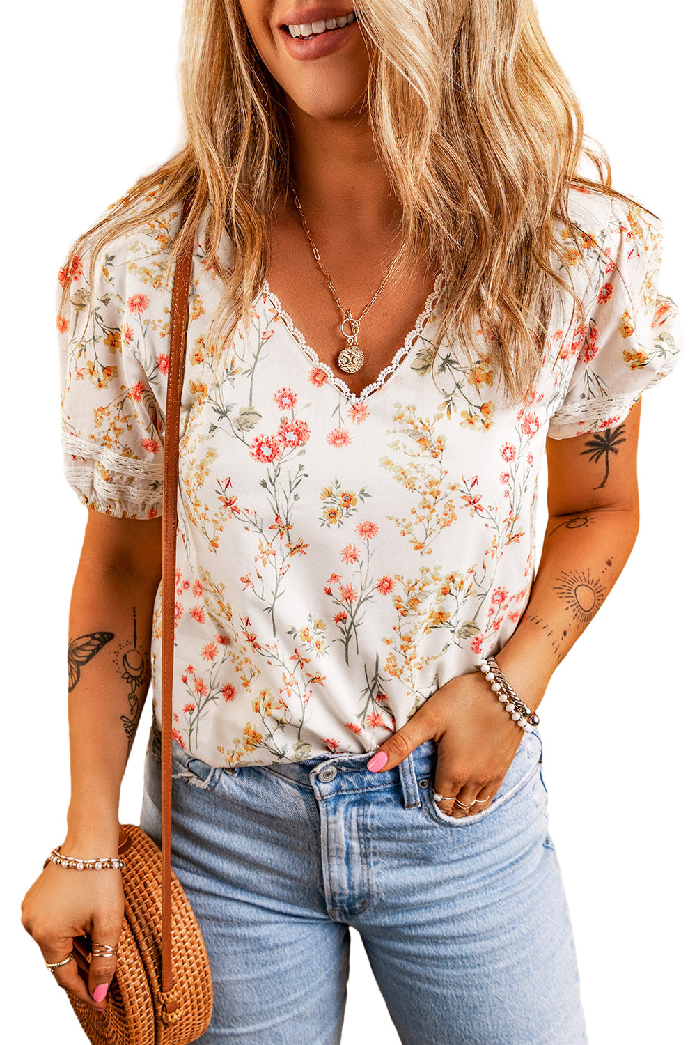 A stylish Boho Floral Lace Blouse featuring a V-neck and short sleeves with intricate lace trim, perfect for casual or formal occasions.