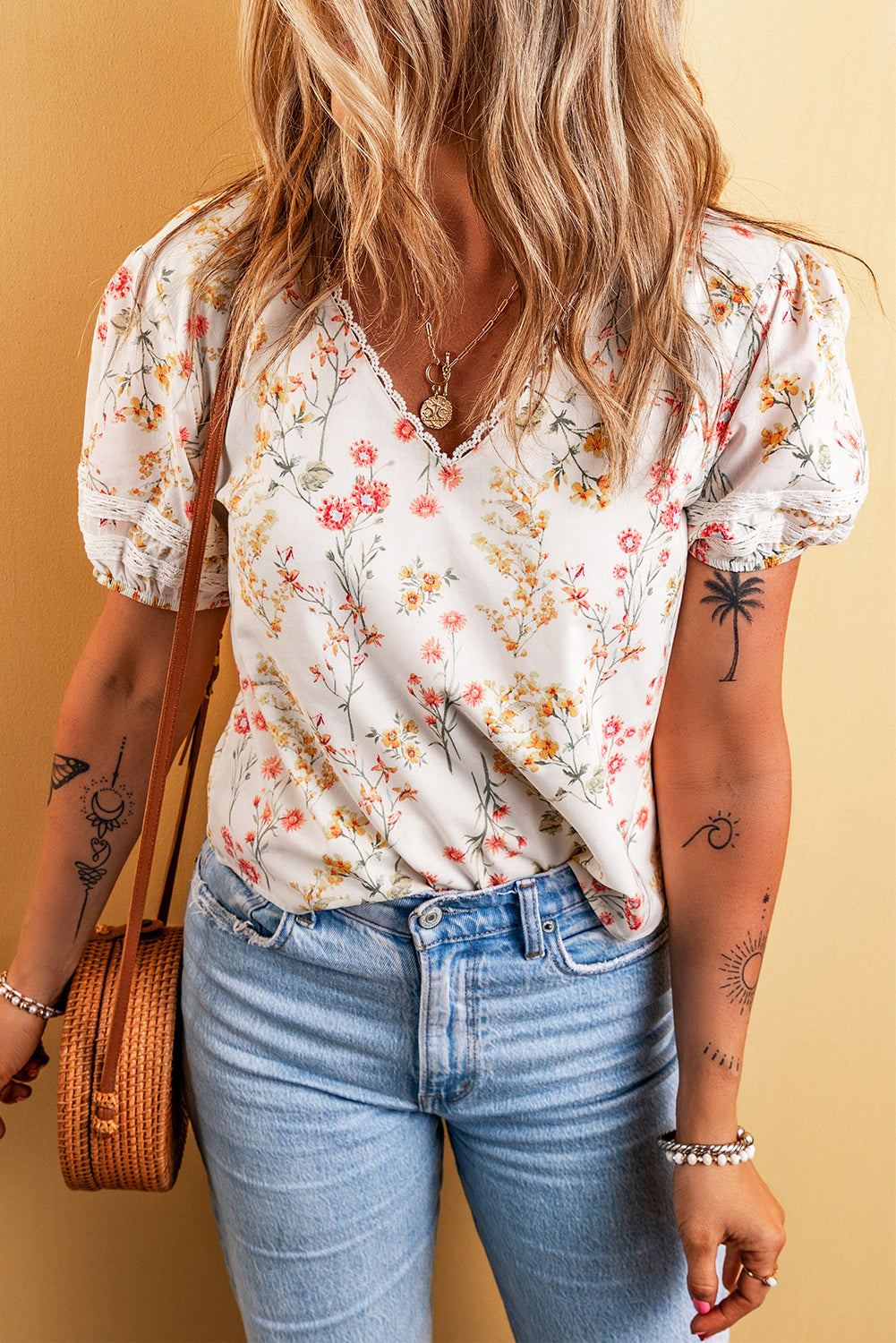 A stylish Boho Floral Lace Blouse featuring a vibrant floral pattern and delicate lace trim, perfect for casual or dressy occasions.