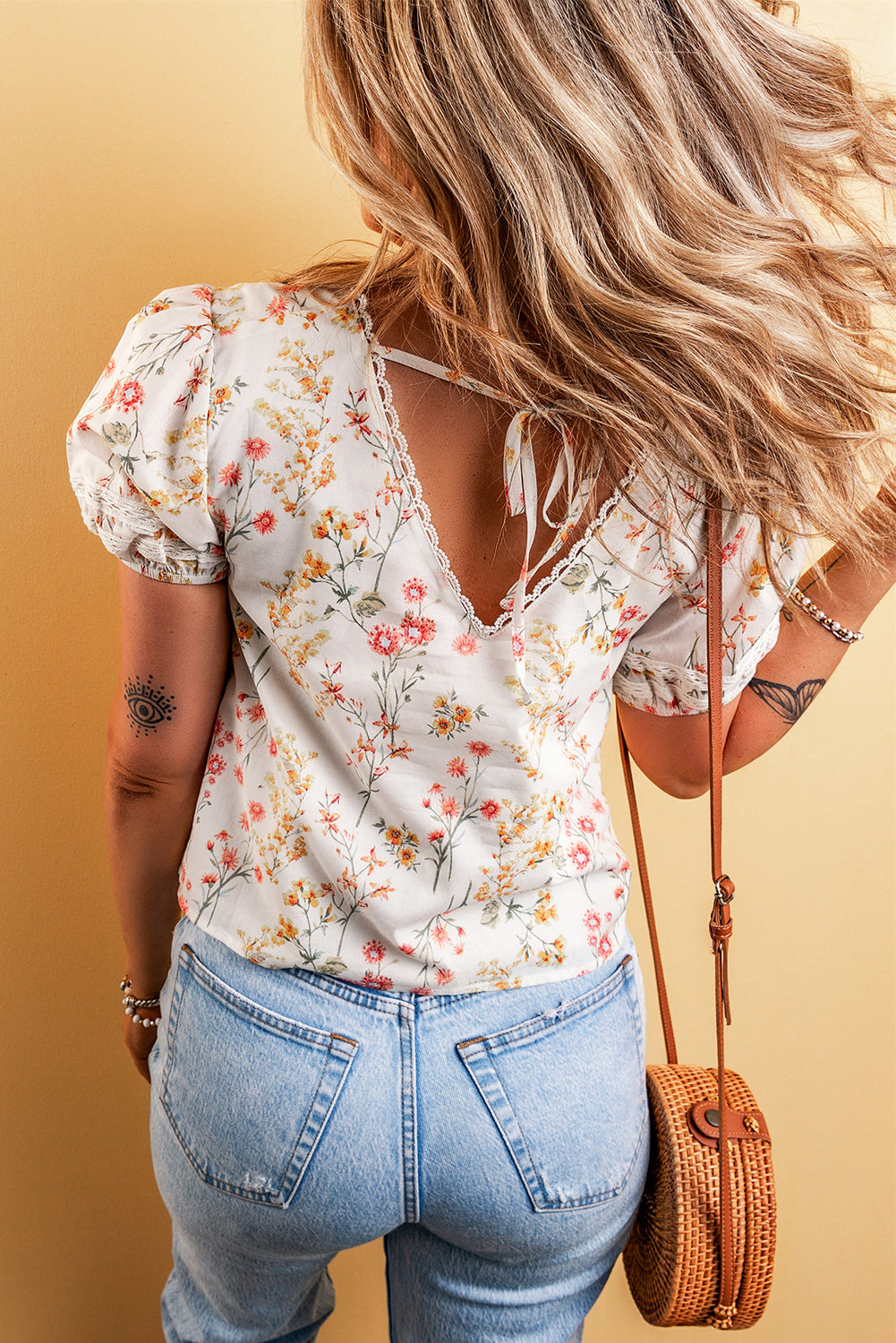 A stylish Boho Floral Lace Blouse featuring a vibrant floral pattern and delicate lace trim, perfect for casual or dressy occasions.